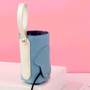USB baby bottle warmer comes in pink and blue